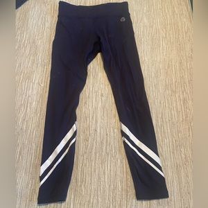 Tory Burch meduim size yoga pant with reflective detail and back pocket